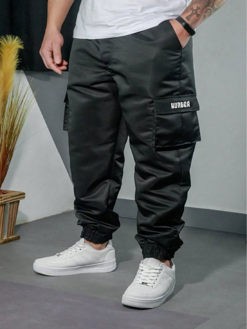 Vendedor IndicadoKit 2 Calça Jogger Bolsos Cargo Corta Vento Masculina Skate Preto/Caqui